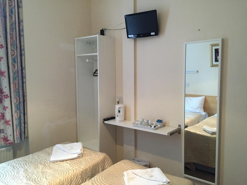 Romanos Hotel Londres Quarto foto